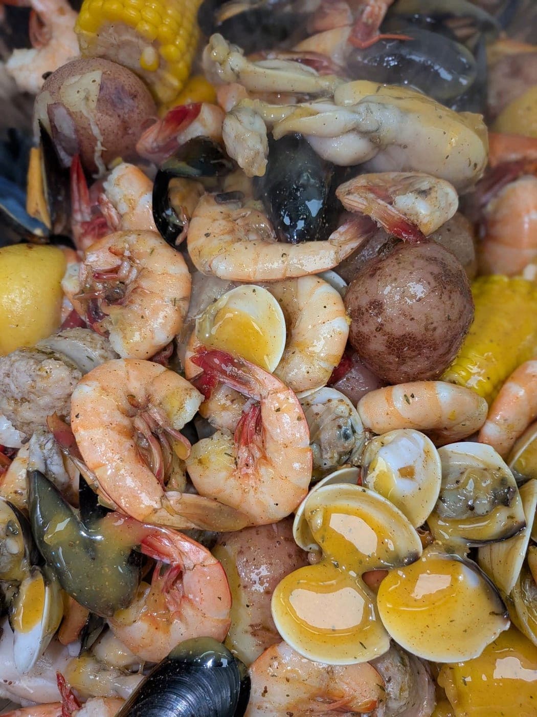 A couples seafood boil: 1 lb small red potatoes, ½ lb housemade sausage, 2 corn cobettes, 12 shell-on shrimp, 1 large snow crab cluster
