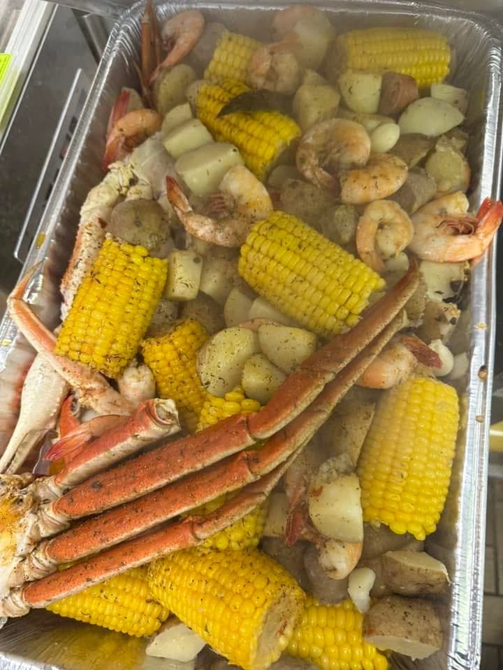 A family seafood boil: 2 lb small red potatoes, 1 lb housemade sausage, 6 corn cobettes, 1 lb shell-on shrimp, 2 large snow crab clusters